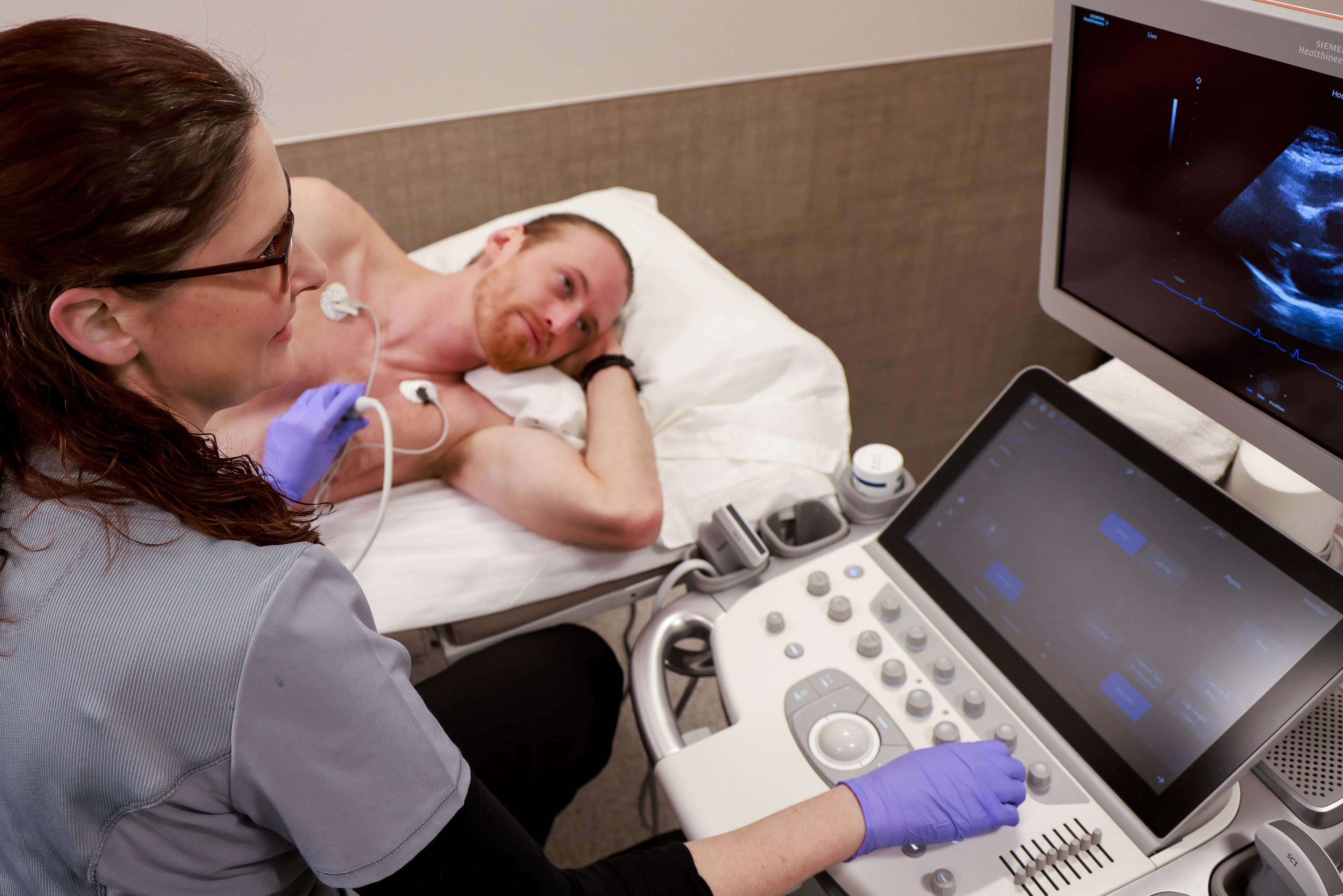 A man getting an ultrasound from a healthcare professional