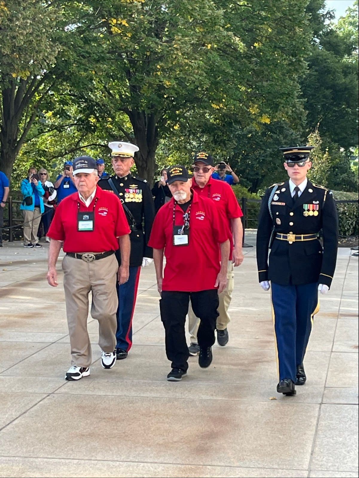 Several veterans helping with a wreath laying at Arlington National Cemetery