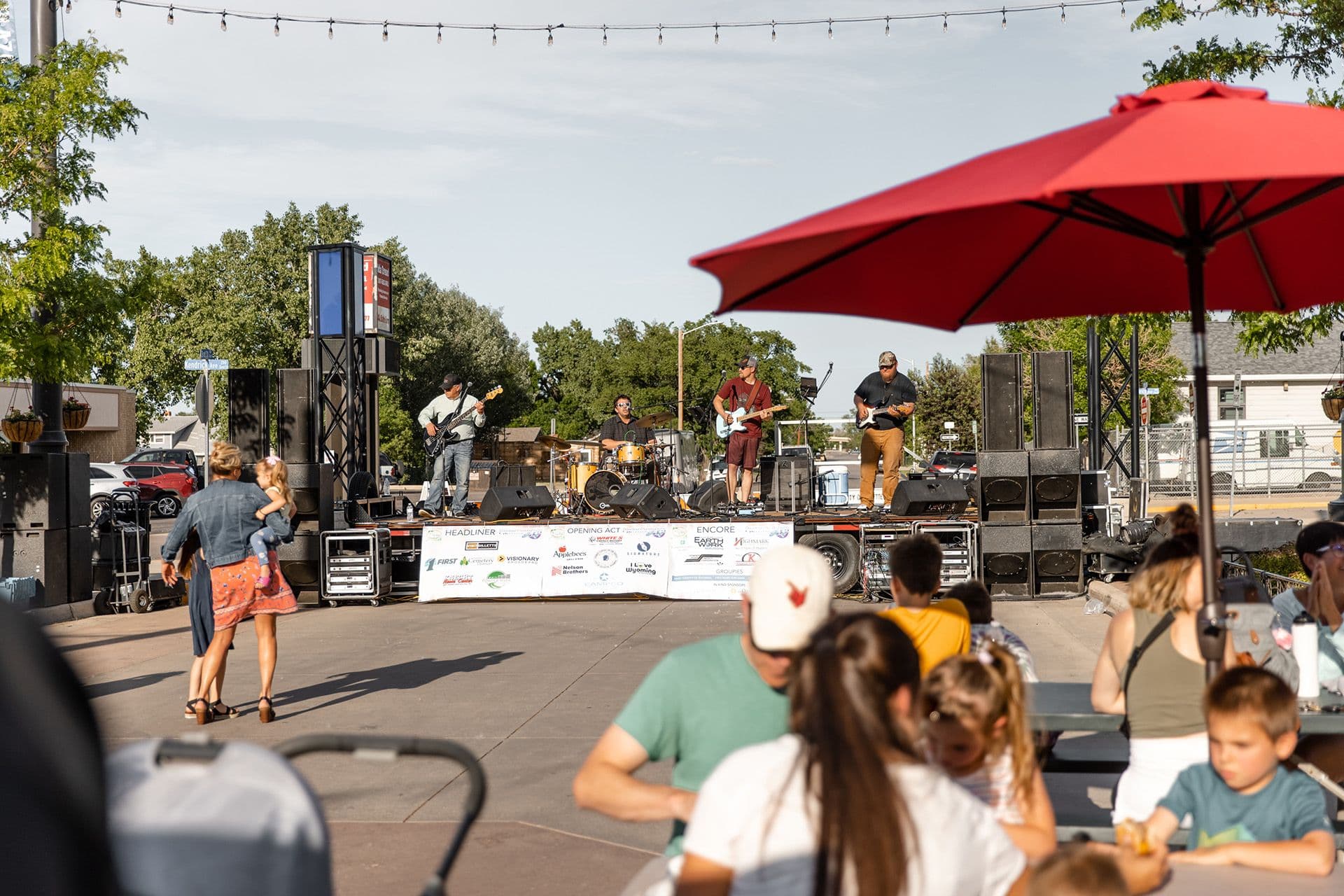 Outdoor stage in small town with band playing